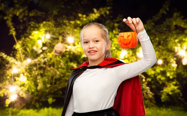 Girl in halloween costume of dracula with pumpkin — Stock Photo, Image