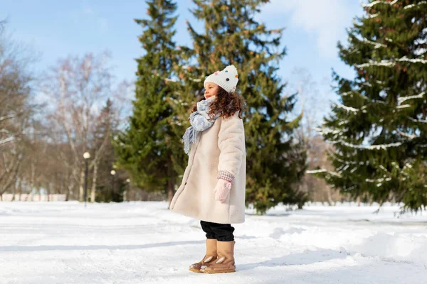 Happy little girl in winter clothes outdoors — Stock Photo, Image