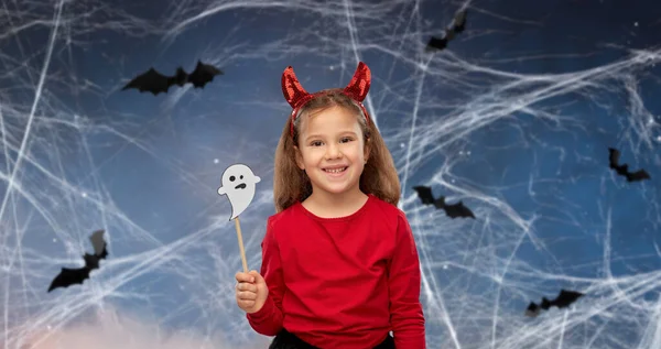 Girl in halloween costume with ghost party prop — Stock Photo, Image