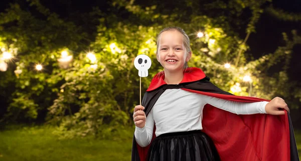 Girl in costume of dracula with cape on halloween — Stock Photo, Image