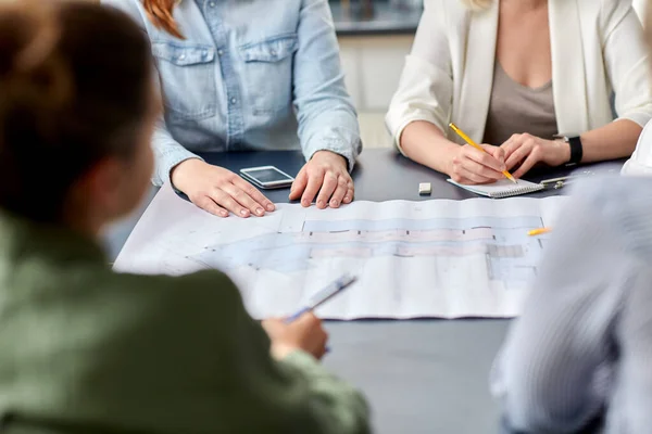 Business team with blueprint working at office — Stock Photo, Image