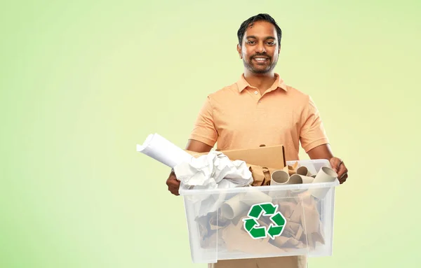 Smiling young indian man sorting paper waste — Stock Photo, Image