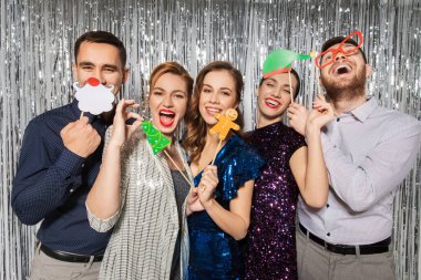 happy friends posing with christmas party props clipart