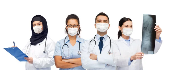 Doctors in masks with stethoscopes and x-ray — Stock Photo, Image