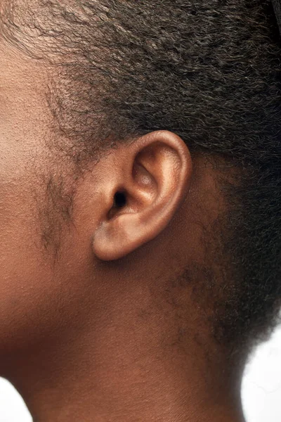 Close up of african american womans ear — Stock Photo, Image