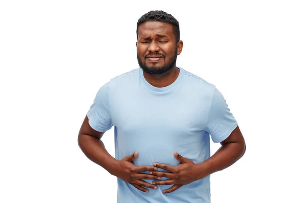 Unhappy man suffering from stomach ache — Stock Photo, Image