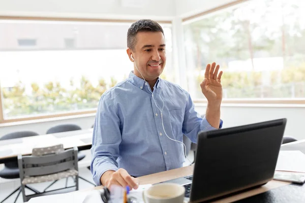 Man with laptop having video call at home office — Stock Photo, Image