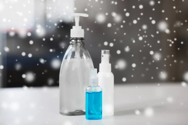 Close up of different hand sanitizers on table — Stock Photo, Image