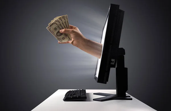 Bunch of money jumping out of the display - Internet trade symbo — Stock Photo, Image