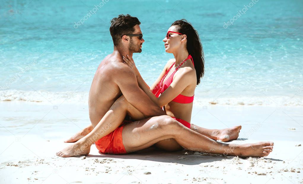 Romantic style portrait of a couple relaxing on a beach