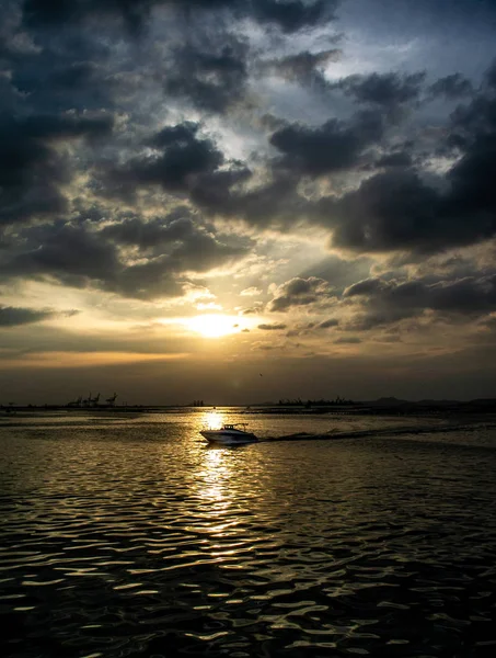 Speed boat at sea with sunset sky — Stock Photo, Image