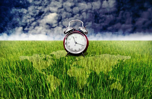 Alarm clock and green rice field with world map overlay, Time to — Stock Photo, Image