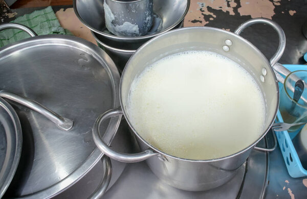 Boiled milk in pot, High angle view
