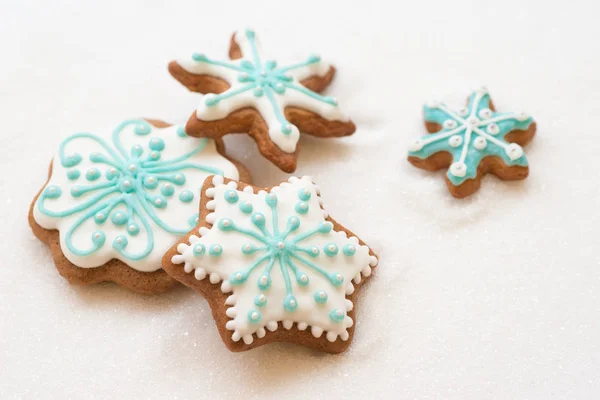 Christmas dekoration with cookies in the shape of snowflakes and stars on a white background — Stock Photo, Image
