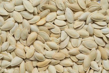 Çiğ beyaz kabak çekirdeği, makro soyut üstten görünüm arka plan