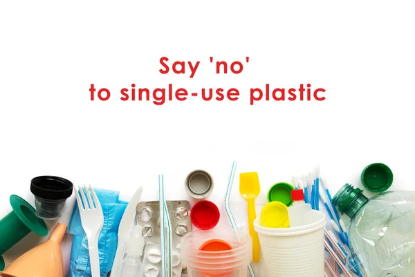 White single-use plastic and other plastic items on a white background