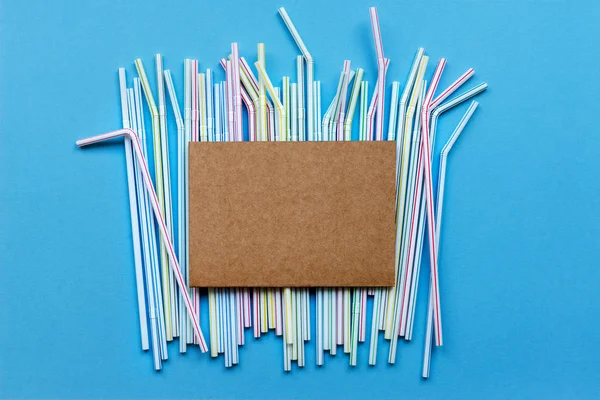 Colored drinking straw on a blue background