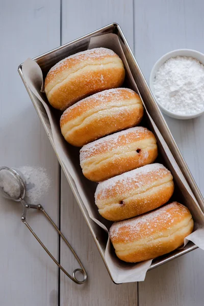 Traditional German Polish Donut with Raspberry Jam Dusted with Icing Sugar — Stock Photo, Image