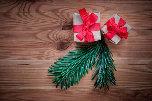Fir branch and two New Years gifts — Stock Photo, Image