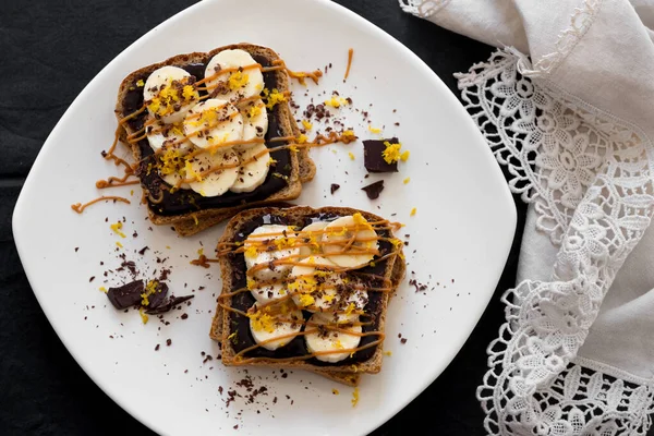 Toast with chocolate cream and bananas — Stock Photo, Image