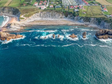 Dramatic view of Playa de la Arnia, rocky coastline in Santander ,Cantabria, Spain clipart