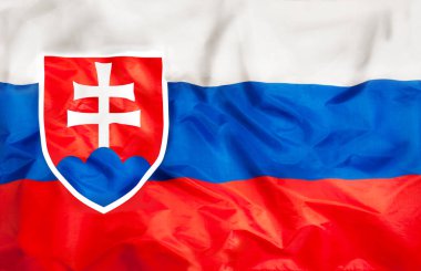 Slovakya ülke bağımsız devlet ulusal bayrak sallayarak kumaş dokusu ile yakın çekim banner 