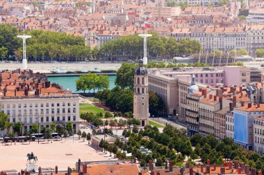 Scenic view of Lyon's main square Place Bellecour and the bell tower of Antonin-Poncet hospital, France clipart