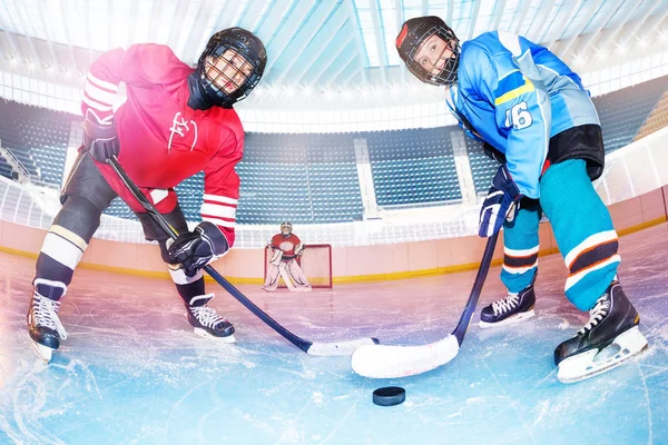 Low Angle Portrait Teenage Boys Hockey Players Challenging Puck Ice — Stock Photo, Image