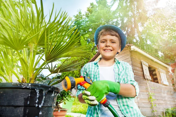 Close Portrait Seven Years Old Boy Watering Palm Tree Using — Stock Photo, Image