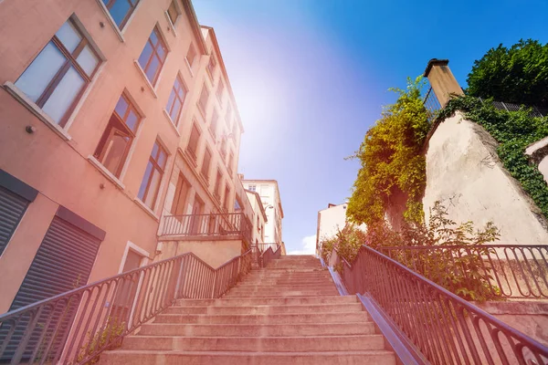 Low-angle view of concrete stairway going up in old district of Lyon city, France