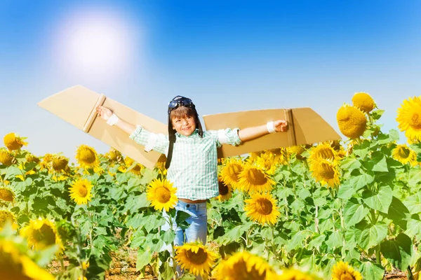 Portrait Smiling Boy Wearing Cardboard Wings Aviator Hat Playing Sunflower — Stock Photo, Image