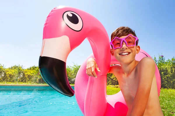 Portrait Teenage Boy Wearing Star Shaped Sunglasses Holding Flamingo Inflatable — Stock Photo, Image