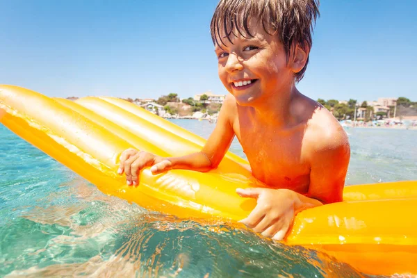 Portrait Cute Boy Floating Big Orange Inflatable Mattress Spending Summer — Stock Photo, Image