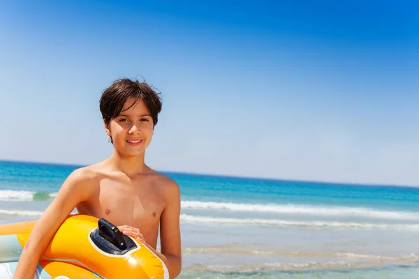 Portrait Happy Teenage Boy Carrying Inflatable Lounge Ready Summer Activities — Stock Photo, Image