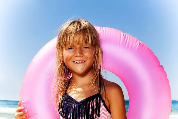 Close Portrait Cute Little Girl Standing Beach Pink Swimming Ring — Stock Photo, Image