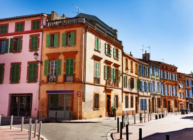 Lovely old houses on narrow streets of Toulouse at sunny day, France clipart