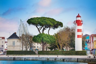 la Rochelle lighthouse and embarkment in downtown historical harbor, France clipart