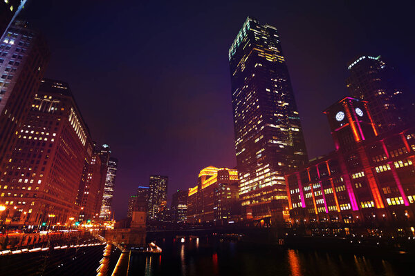Chicago river with Marshall Suloway Bridge leading to the Loop business district at night, USA