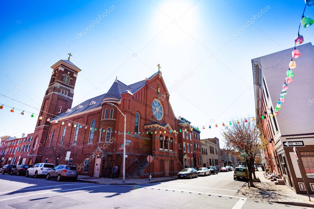 Red brick building of St. Leo's Church in Little Italy at sunny day, Baltimore, United States