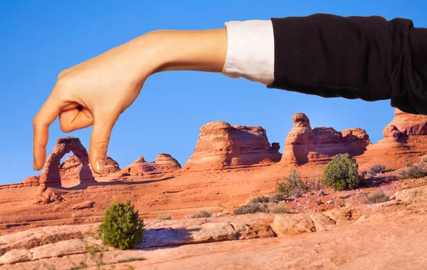 Optical Illusion Woman Hand Holding Natural Sandstone Arch Thumb Forefinger — Stock Photo, Image