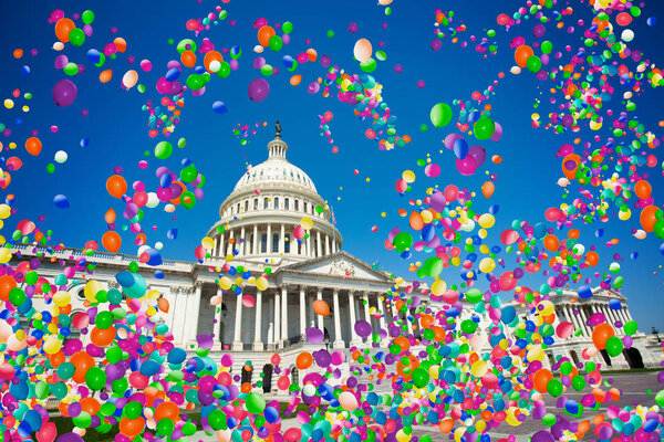 USA capitol in Washington with many colorful air balloons flying around, festive celebration concept