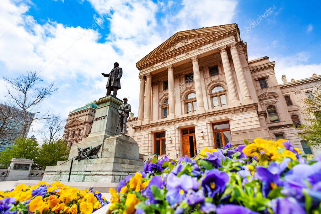Oliver Perry Morton statue in front of the Indiana State Capitol building in springtime, Indianapolis, USA