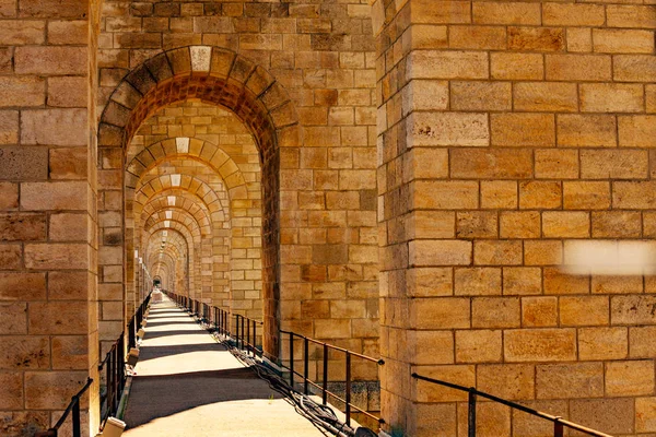Perspective of stone arched abutments and sidewalk of Chaumont viaduct in France