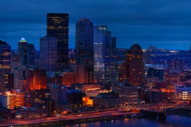 Night view of Pittsburg Downton skyline over Monongahela river, Pennsylvania, USA