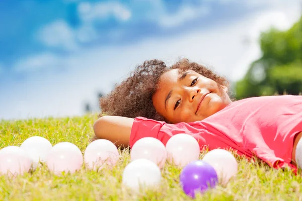 Portrait Little Girl Laying Grass Colorful Playing Balls Lawn — Stock Photo, Image