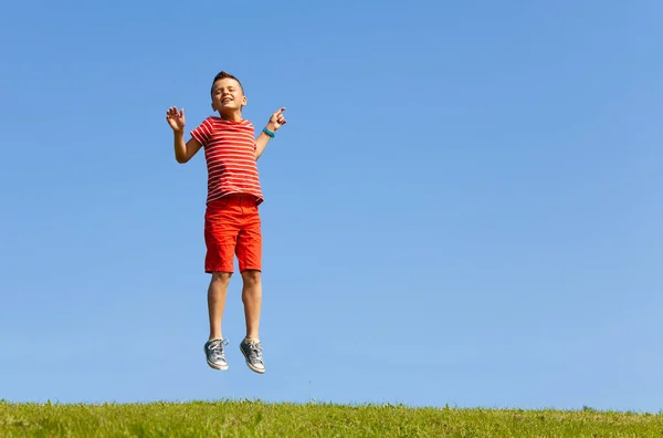 Happy Young School Age Boy Jump High Sky Lifting Hands — Stock Photo, Image