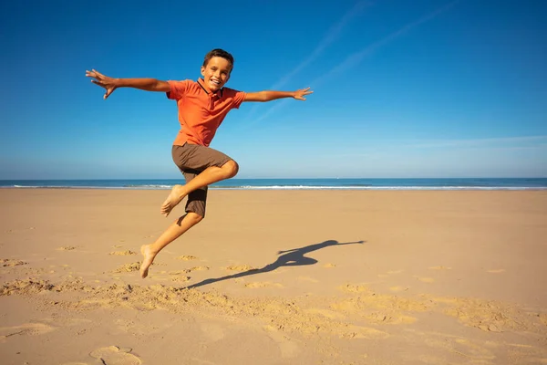 Profile Portrait Happy Boy Jumping High Holding Knees Together Smiling — Stock Photo, Image