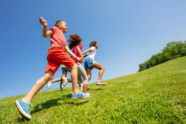 Profile View Cute Kids Run Fast Park Lawn Holding Hands — Stock Photo, Image