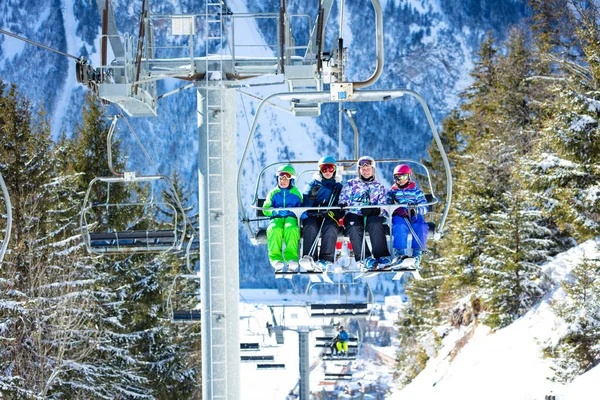 Four Friends Kids Sit Together Chairlift Lifting Mountain Passing Winter — Stock Photo, Image