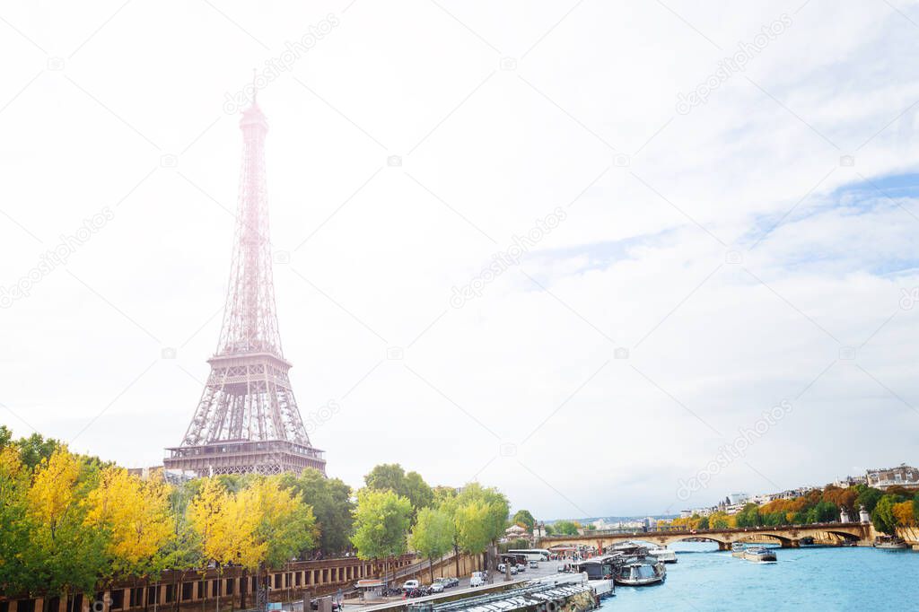 View from bridge on Siena to Eiffel tower in Paris with fresh spring trees